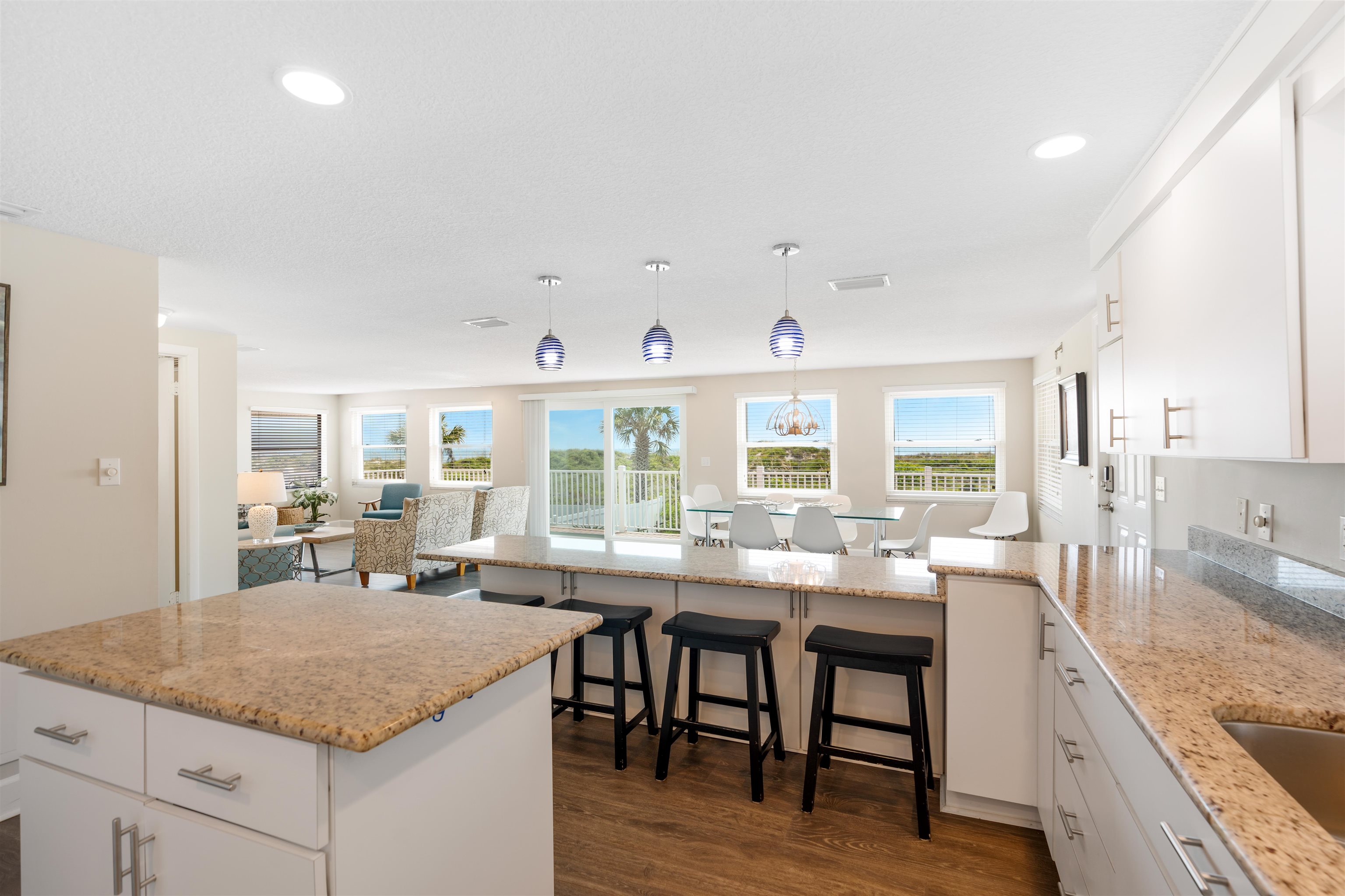 5424 Atlantic View St. Augustine, FL 32080 - Photo 16 of 42 a kitchen with granite countertop lots of counter top space and dining table