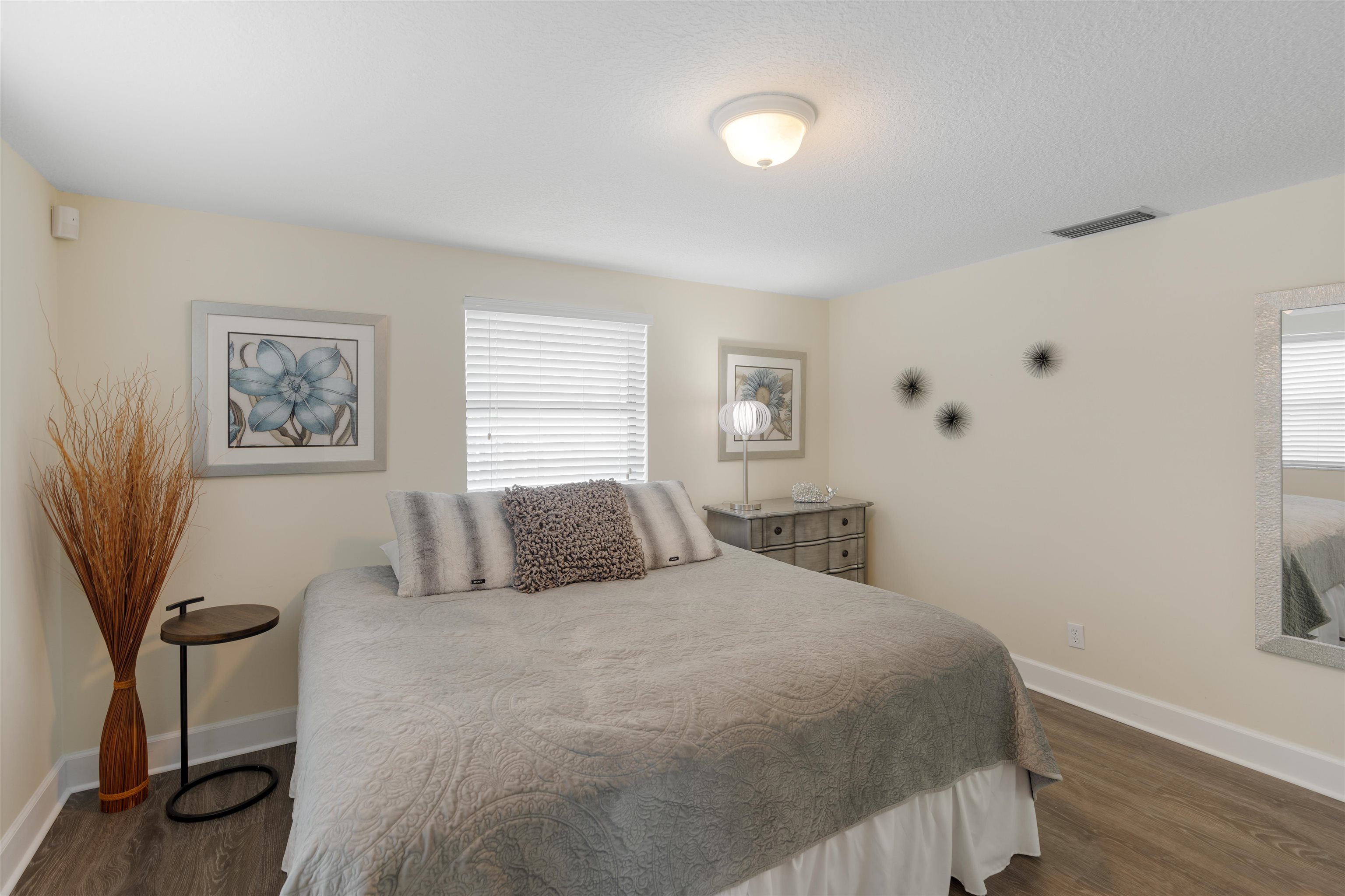 5424 Atlantic View St. Augustine, FL 32080 - Photo 21 of 42 a bedroom with a large bed and a window