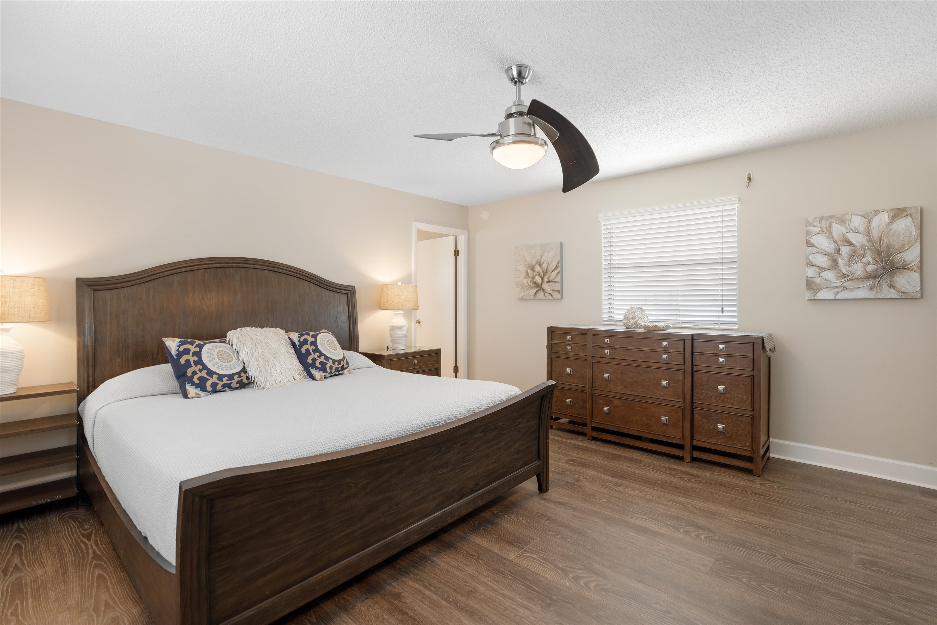 5424 Atlantic View St. Augustine, FL 32080 - Photo 26 of 42 a bedroom with a bed and wooden floor