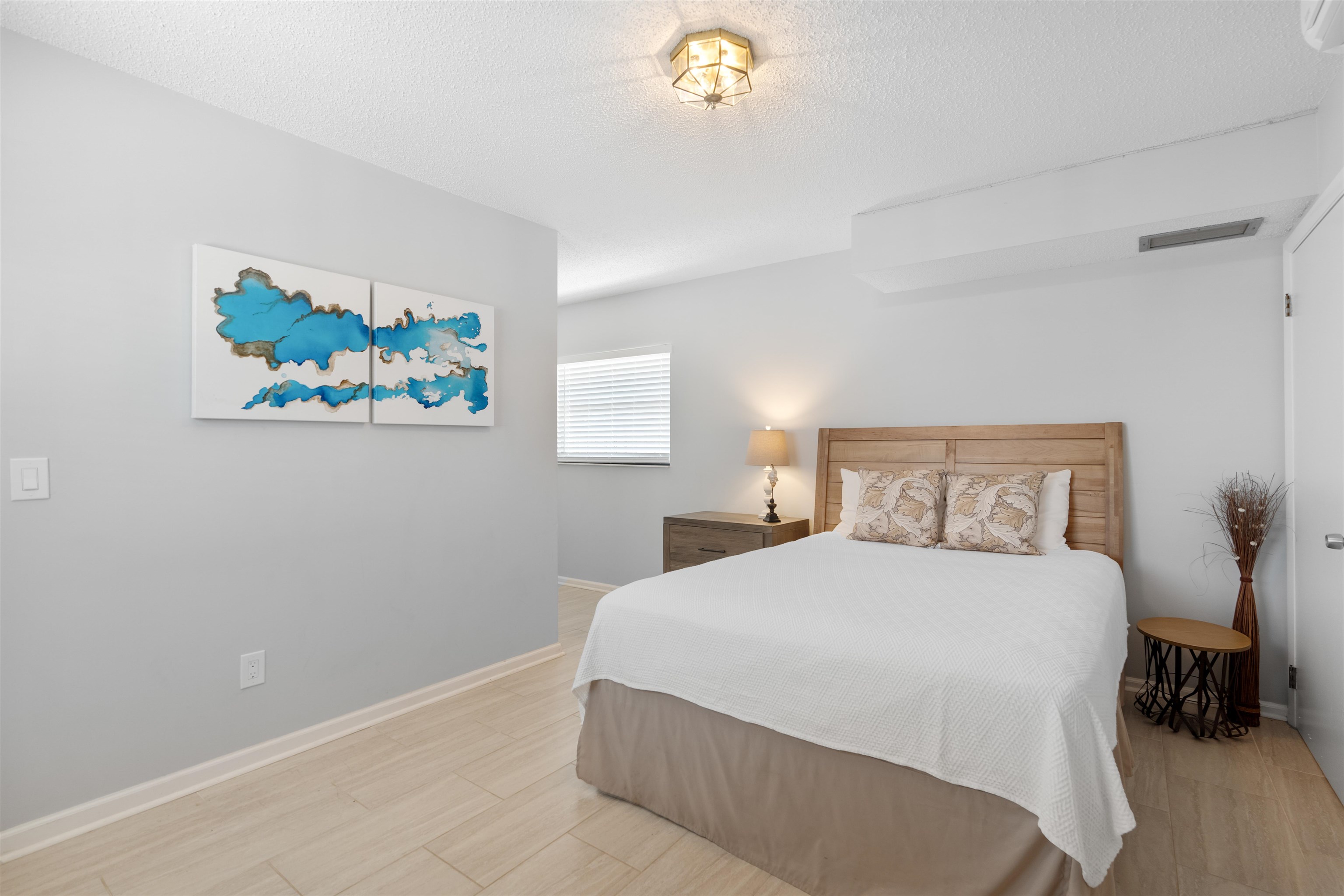 5424 Atlantic View St. Augustine, FL 32080 - Photo 33 of 42 a bedroom with a bed and a painting on the wall