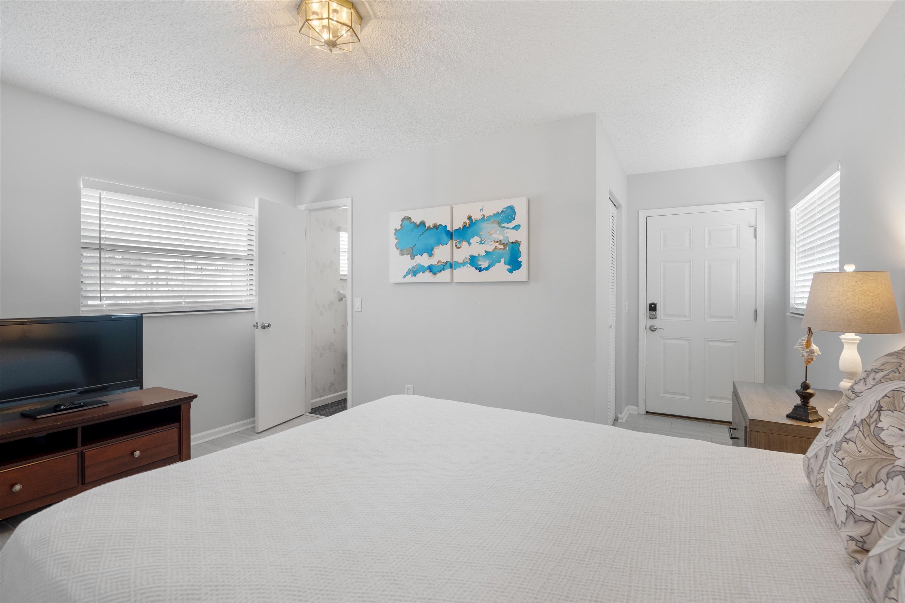 5424 Atlantic View St. Augustine, FL 32080 - Photo 34 of 42 a bedroom with a bed and a flat screen tv