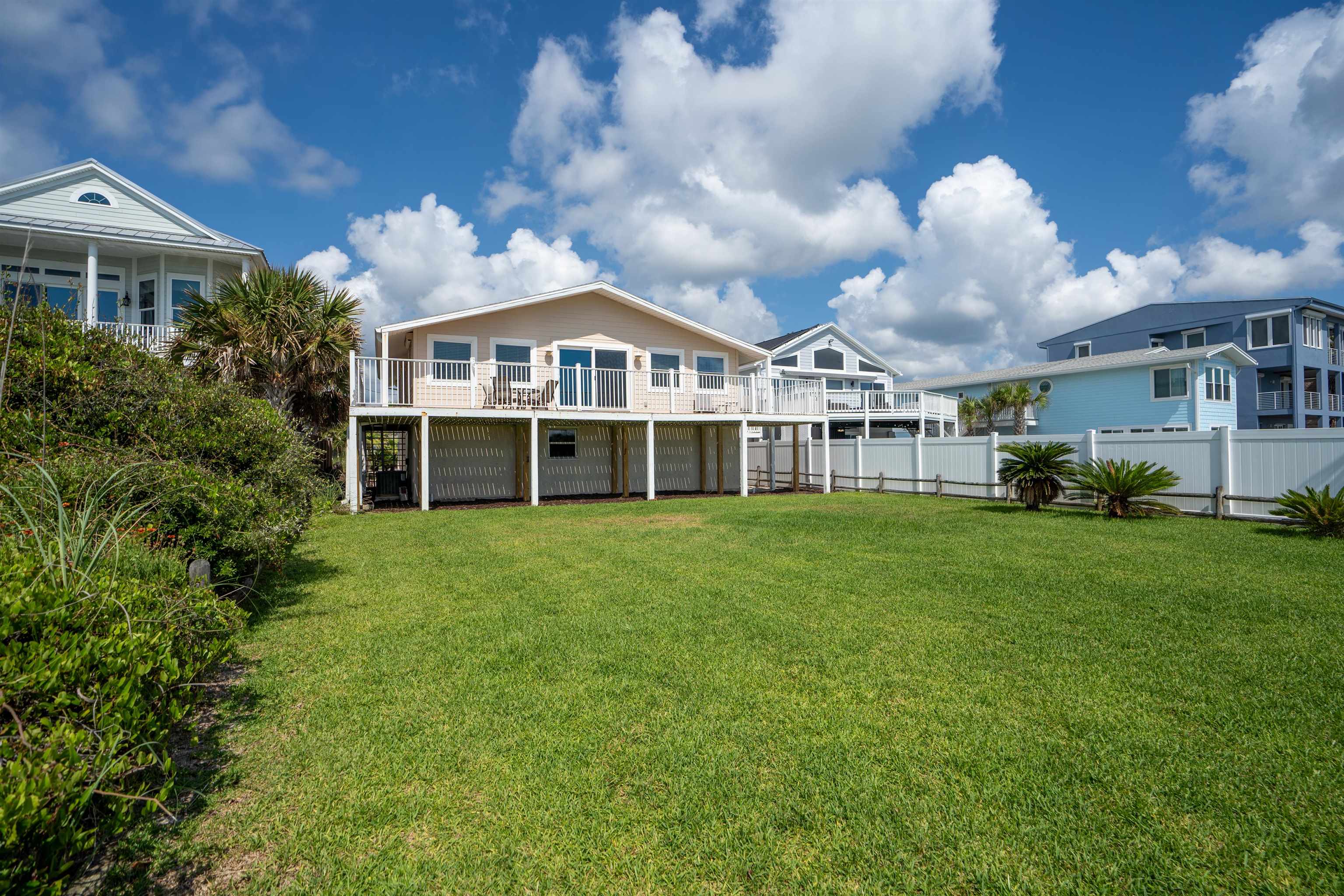 5424 Atlantic View St. Augustine, FL 32080 - Photo 39 of 42 a front view of a house with a garden