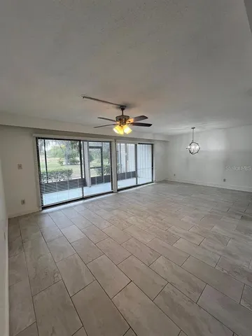 a kitchen with granite countertop a refrigerator and a sink