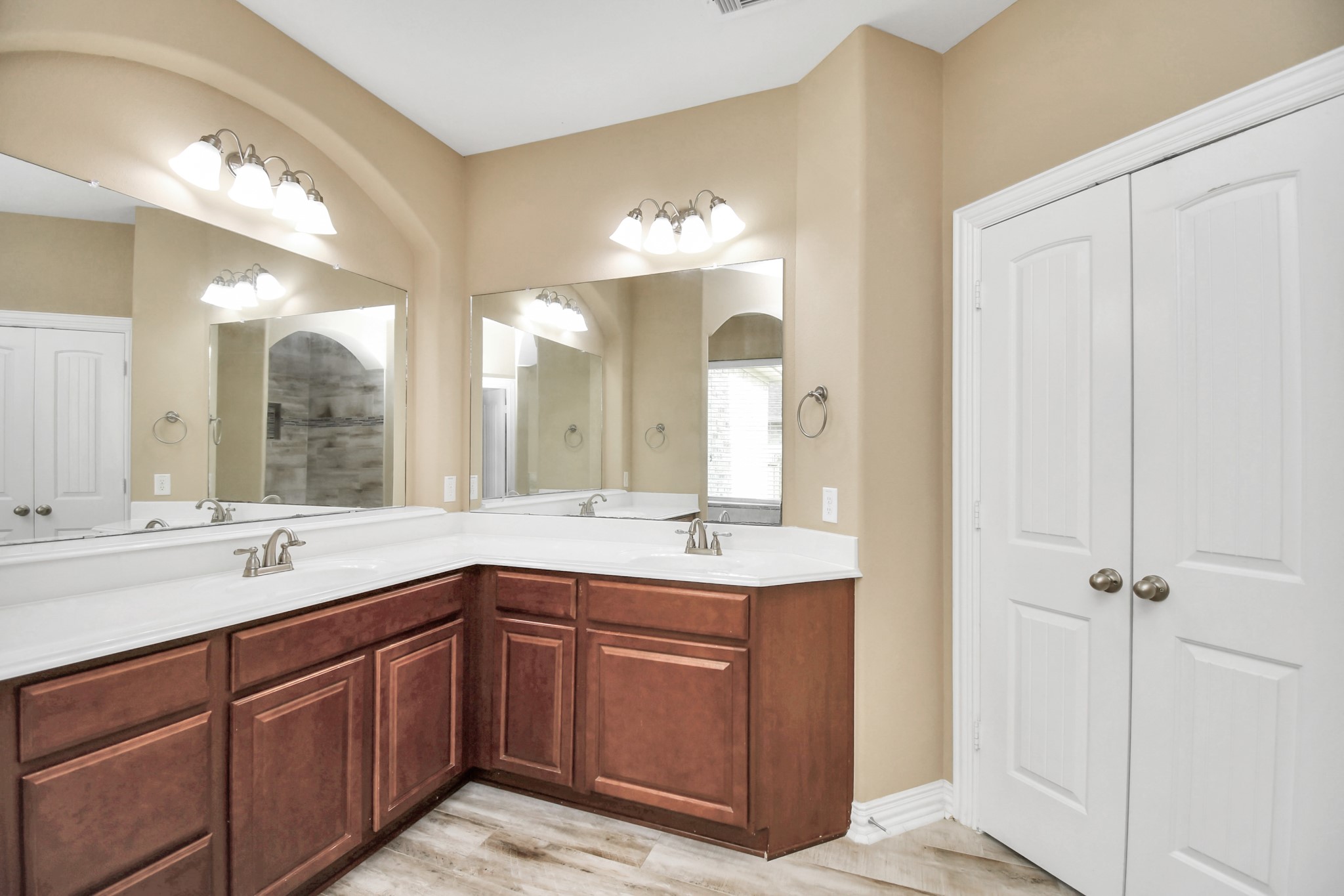 9511 Emerald Lakes Drive Rosharon, TX 77583 - Photo 19 of 38 a bathroom with a double vanity sink and a mirror