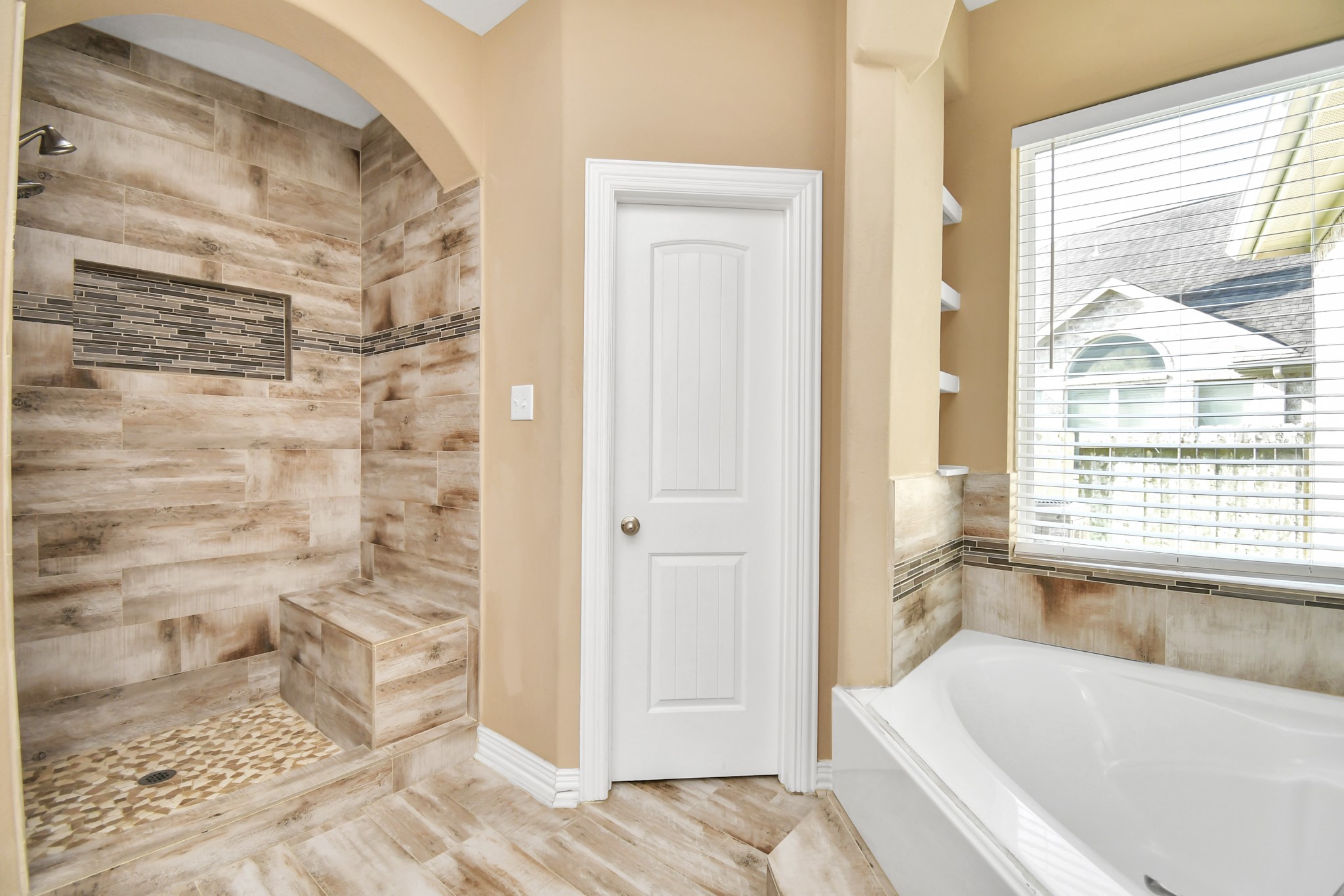 9511 Emerald Lakes Drive Rosharon, TX 77583 - Photo 20 of 38 a bathroom with a bathtub and a shower