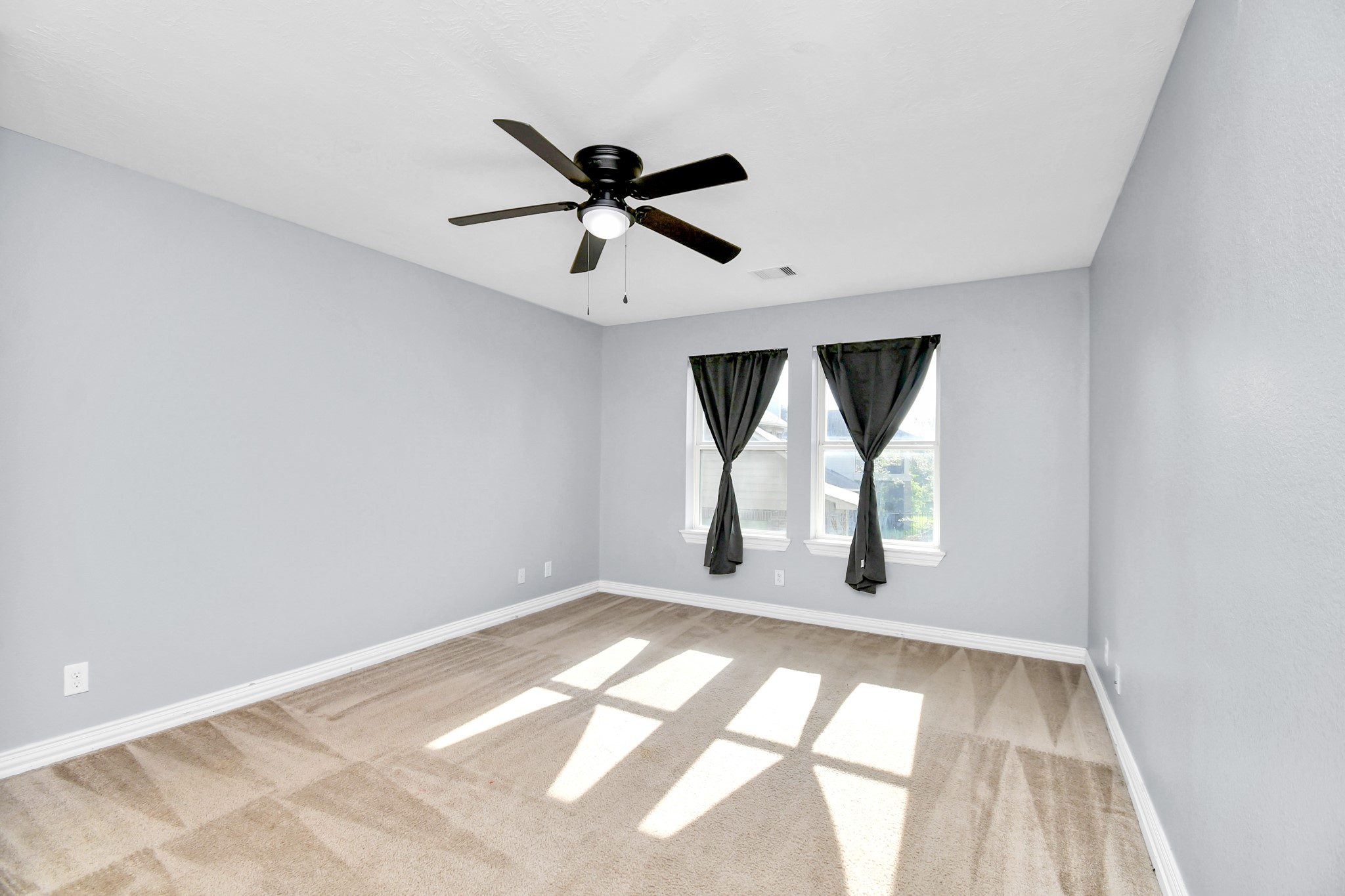 9511 Emerald Lakes Drive Rosharon, TX 77583 - Photo 24 of 38 a view of empty room with wooden floor and fan