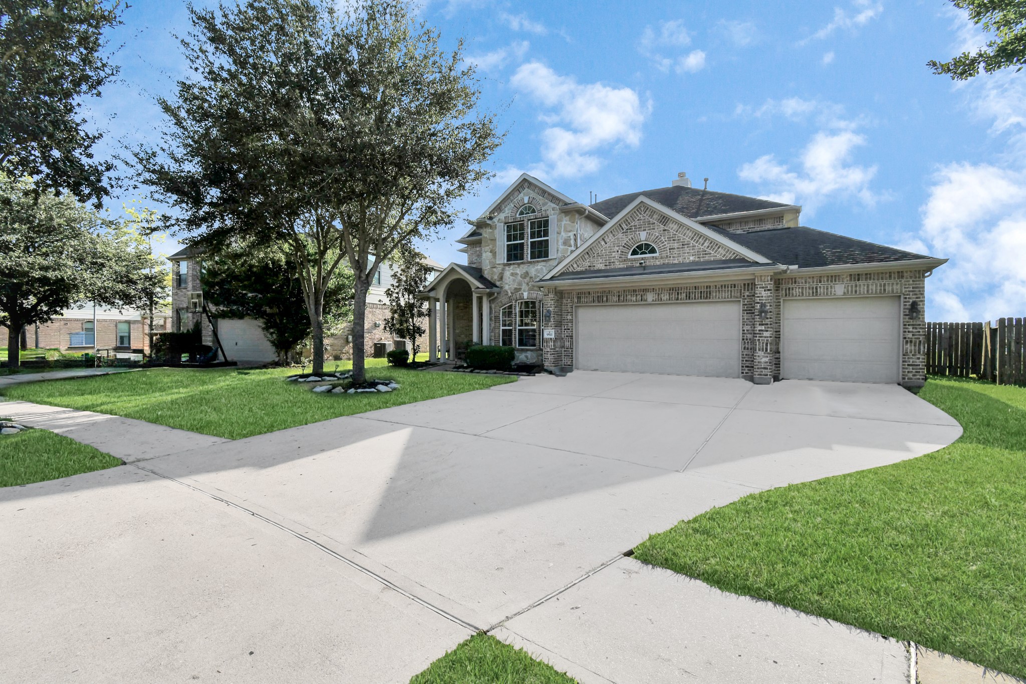 9511 Emerald Lakes Drive Rosharon, TX 77583 - Photo 30 of 38 a front view of a house with a yard