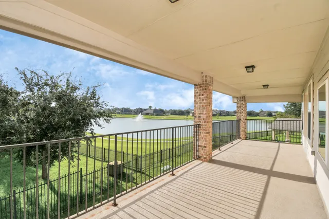 a view of balcony with wooden floor
