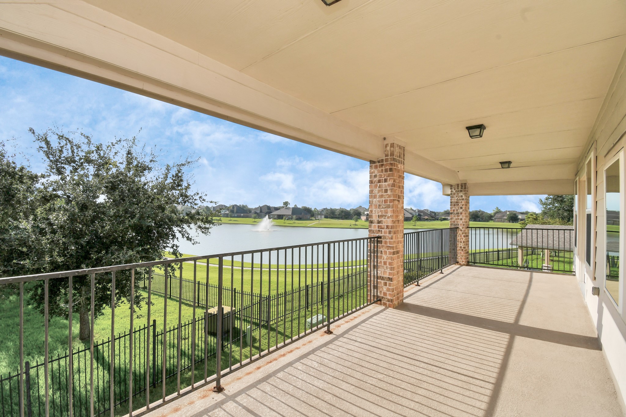 9511 Emerald Lakes Drive Rosharon, TX 77583 - Photo 3 of 38 a view of balcony with wooden floor