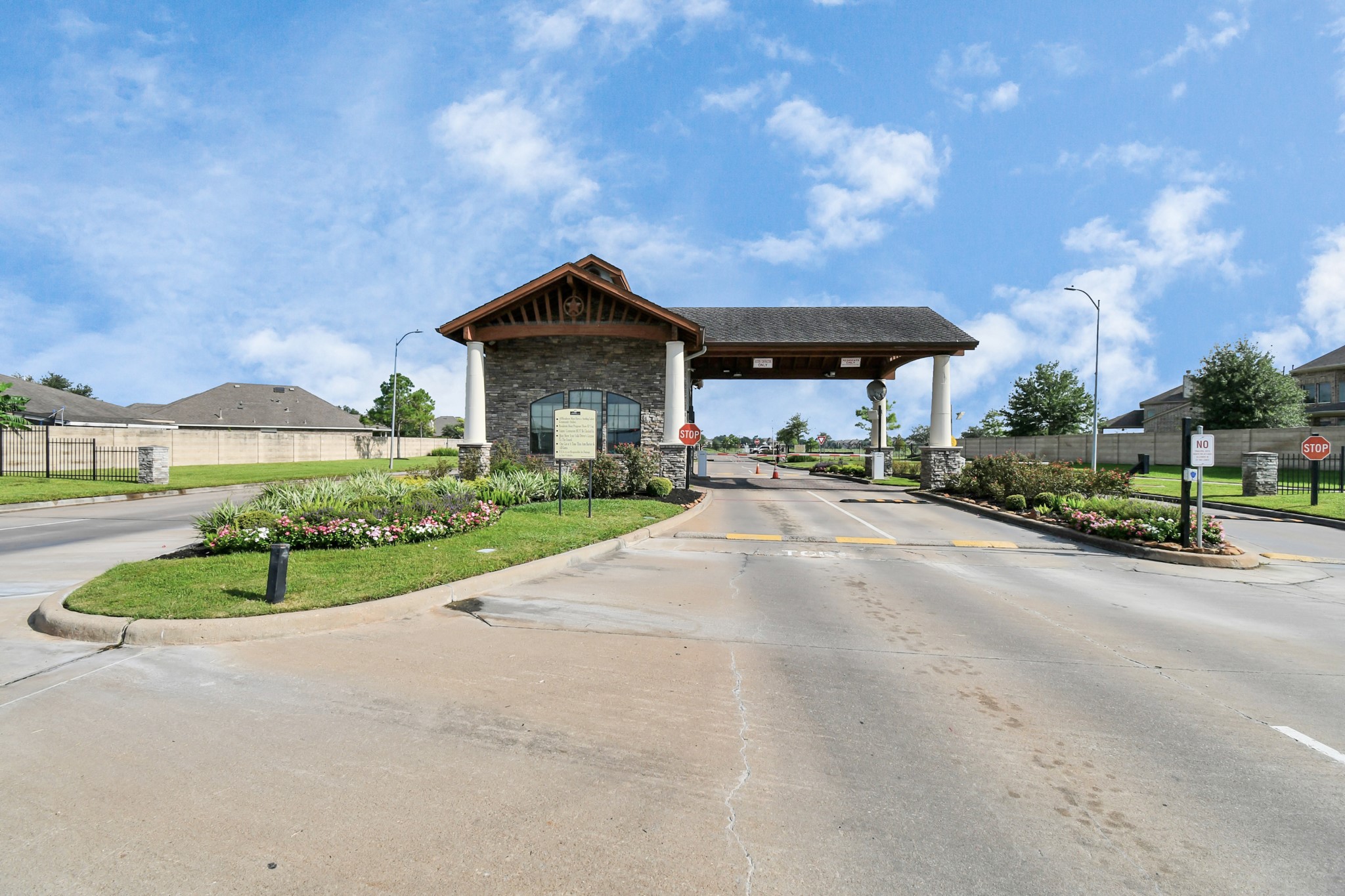 9511 Emerald Lakes Drive Rosharon, TX 77583 - Photo 34 of 38 a view of a house with a yard and table and chairs under an umbrella