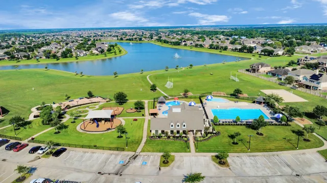 an aerial view of a play ground with large trees