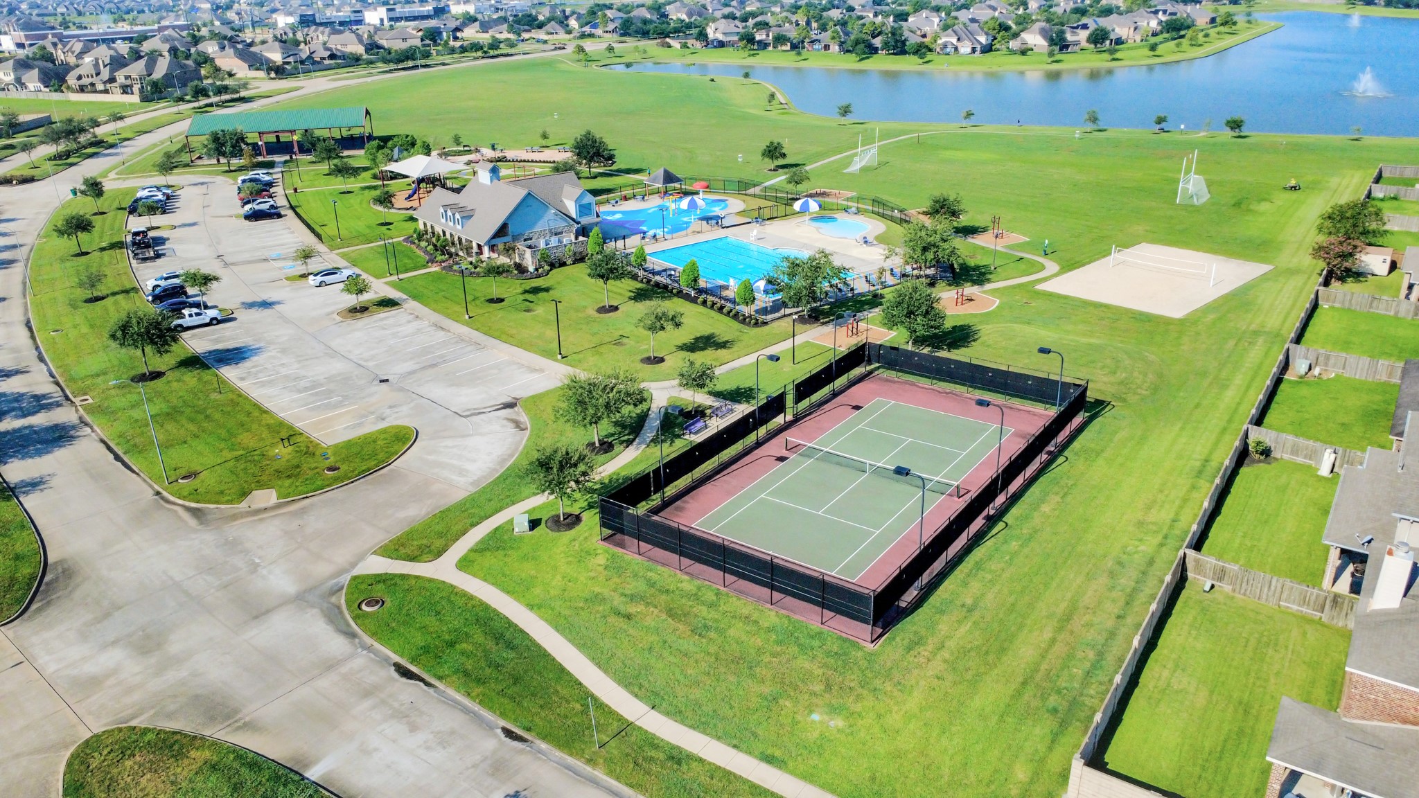 9511 Emerald Lakes Drive Rosharon, TX 77583 - Photo 37 of 38 an aerial view of a pool a yard lake and outdoor seating