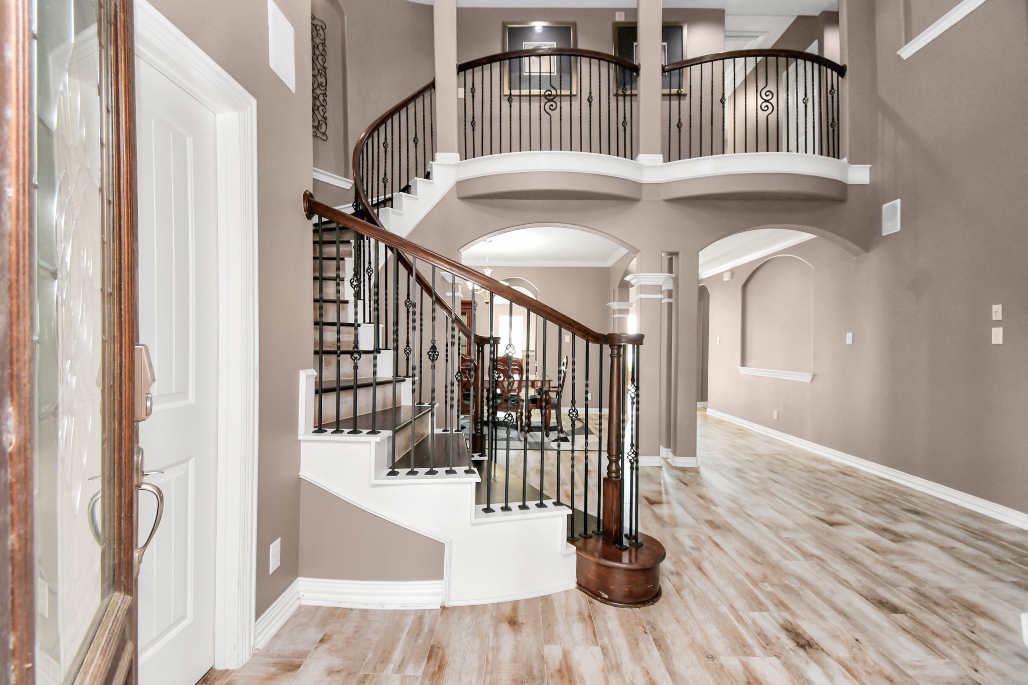 9511 Emerald Lakes Drive Rosharon, TX 77583 - Photo 4 of 38 a view of staircase with railing and a chandelier