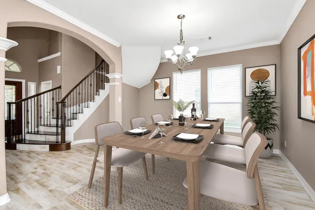 a view of a dining room with furniture window and wooden floor