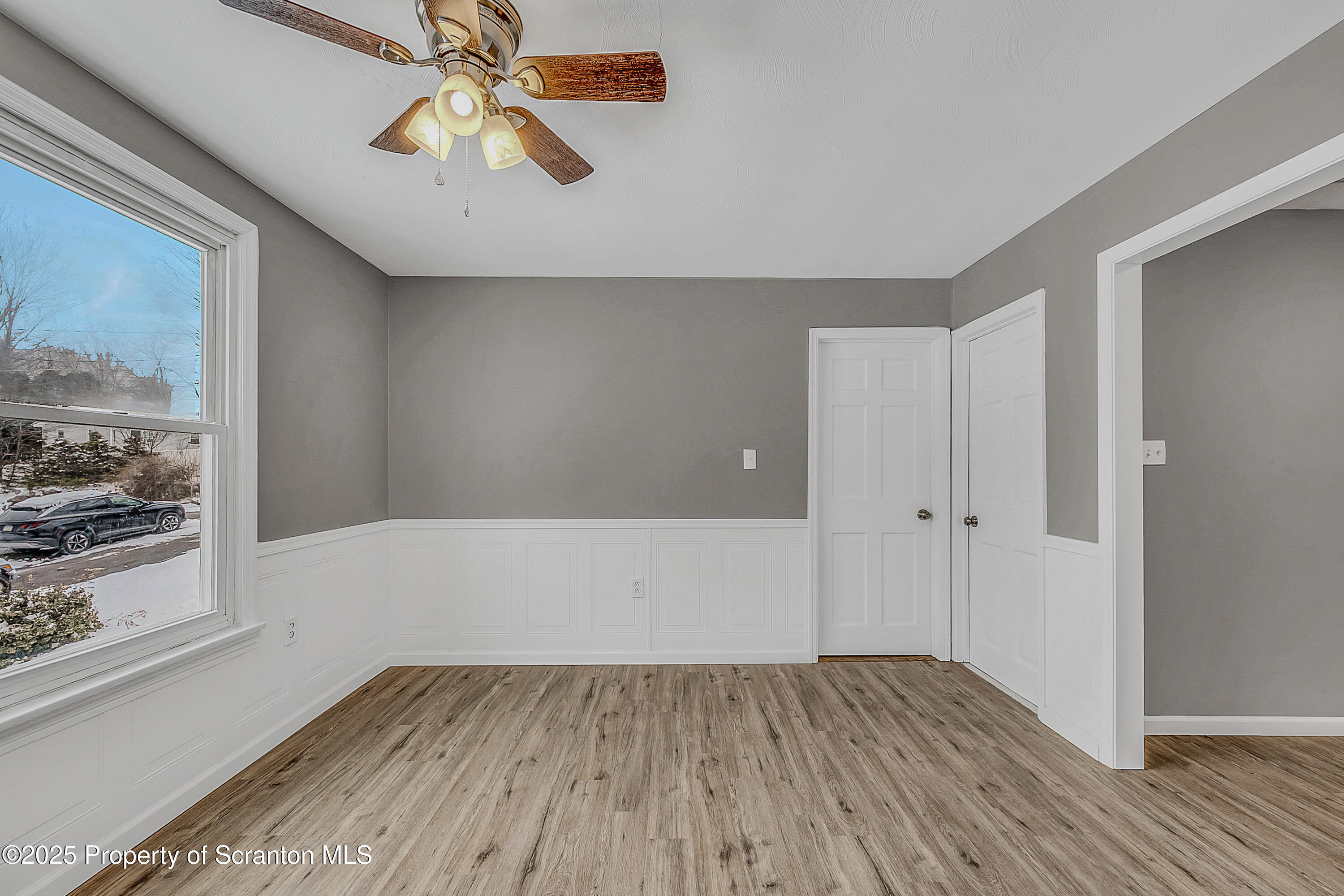 206 Gardner Street Moscow, PA 18444 - Photo 17 of 50 a view of an empty room with wooden floor and a window