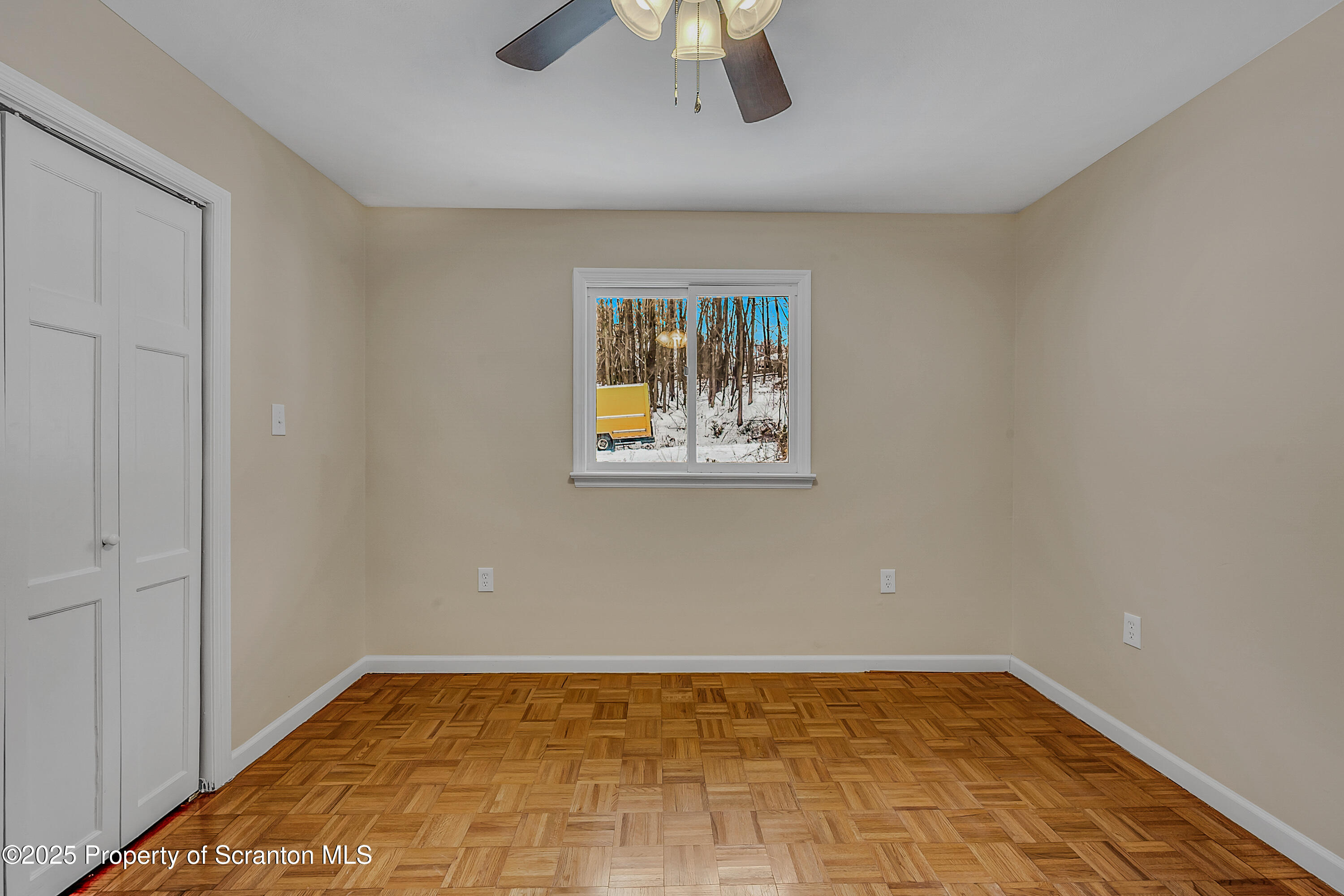 206 Gardner Street Moscow, PA 18444 - Photo 27 of 50 a view of an empty room with window and chandelier fan
