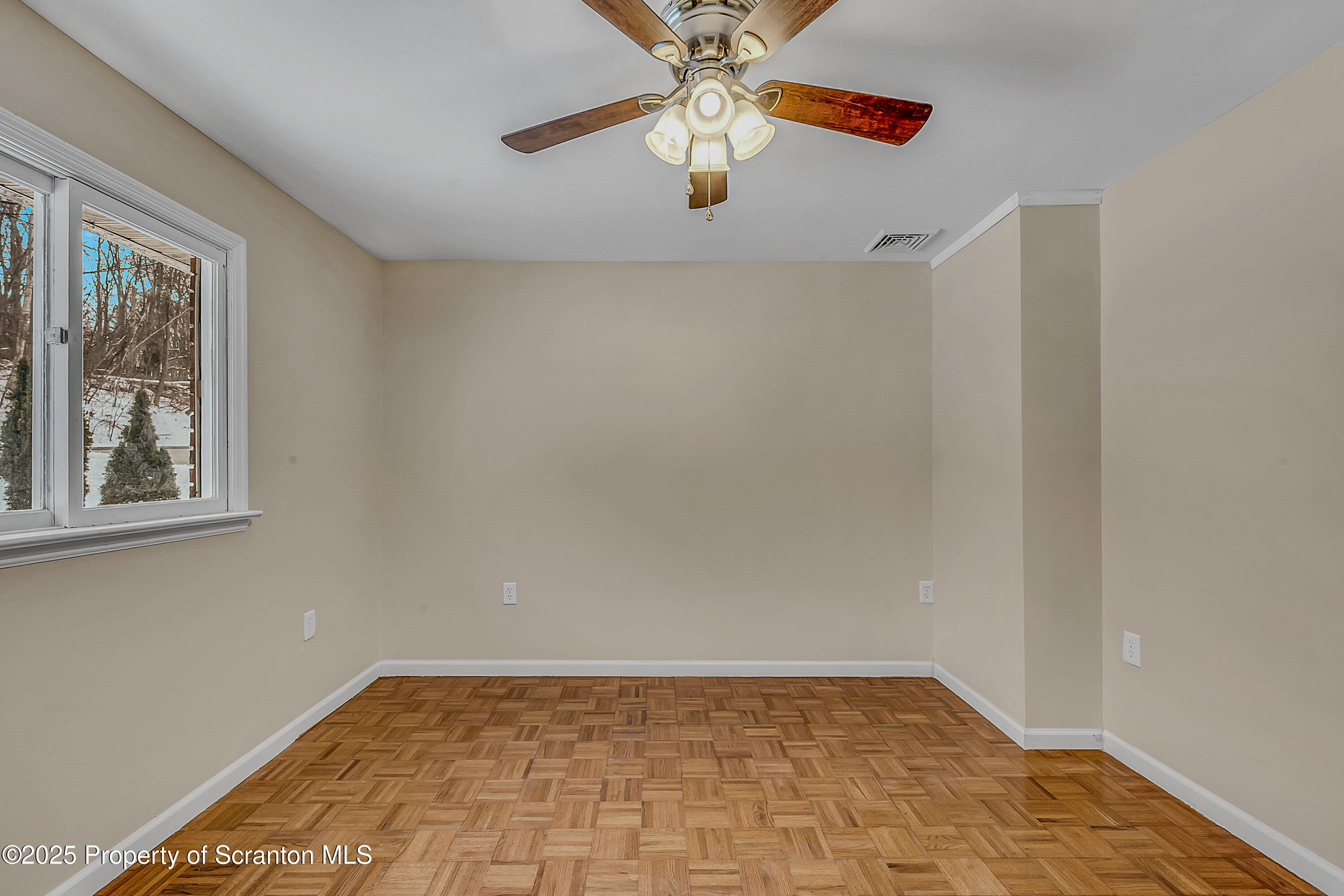 206 Gardner Street Moscow, PA 18444 - Photo 29 of 50 a view of an empty room with window and chandelier fan