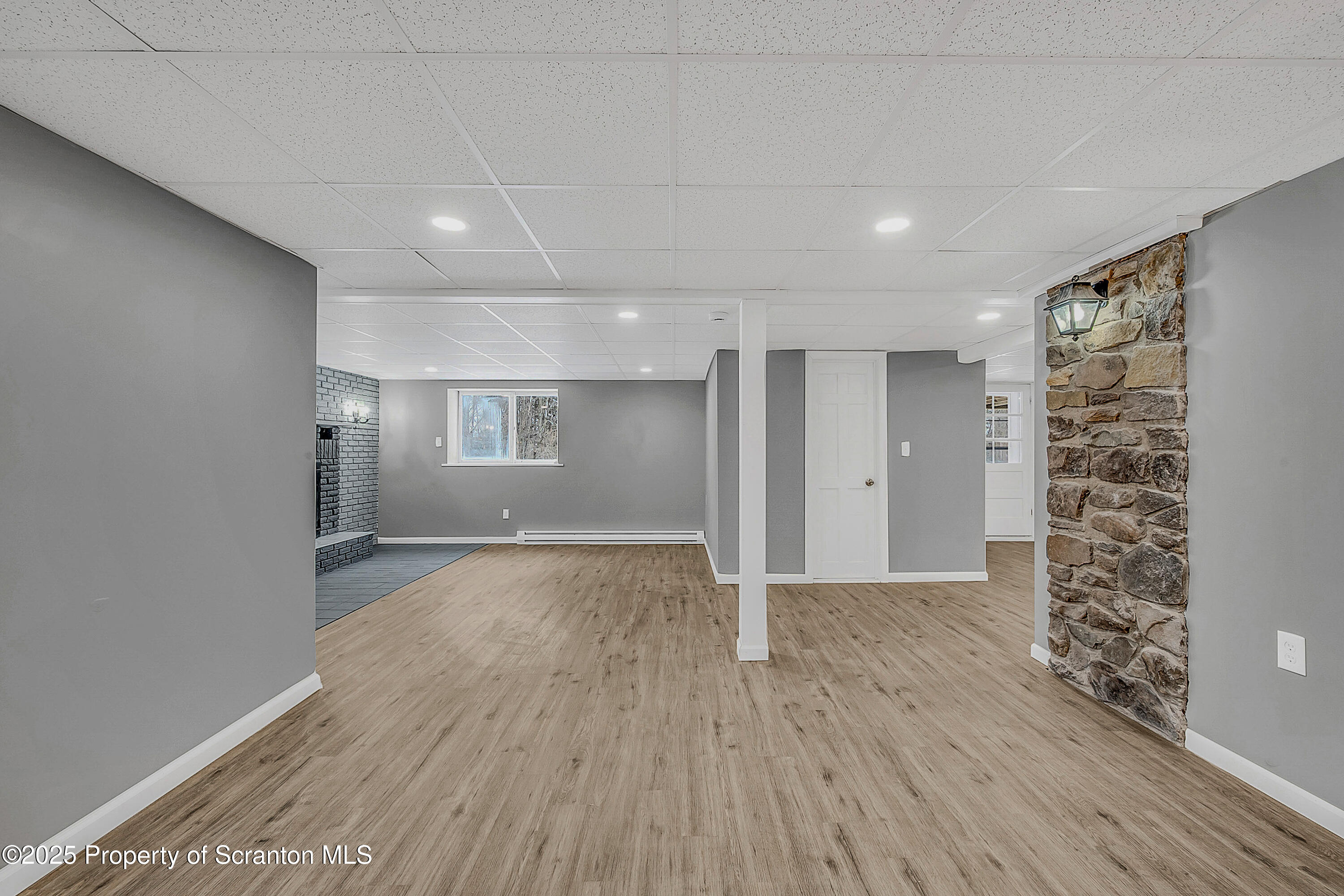 206 Gardner Street Moscow, PA 18444 - Photo 43 of 50 a view of an empty room with wooden floor and a window