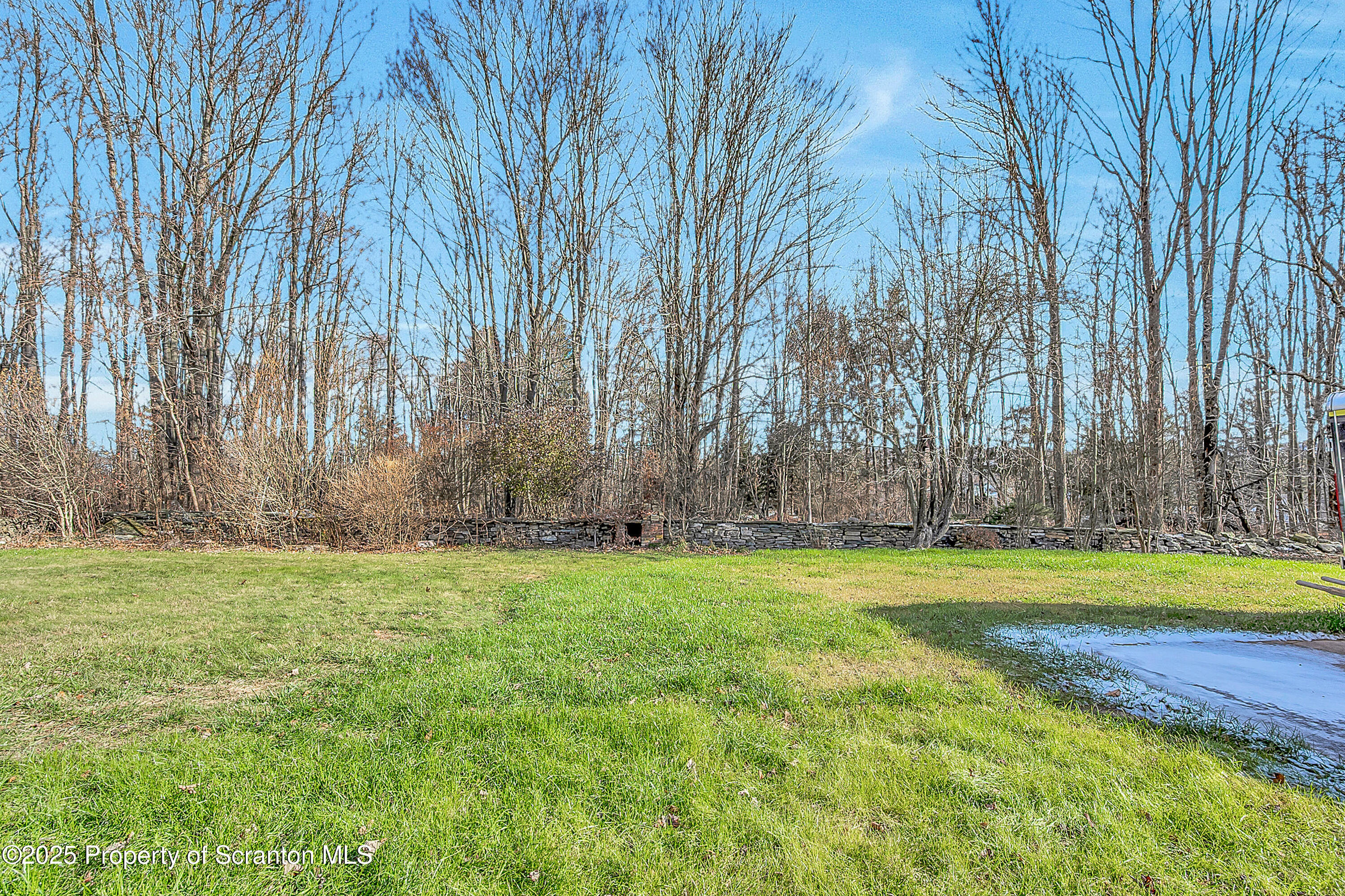 206 Gardner Street Moscow, PA 18444 - Photo 6 of 50 a swimming pool with wooden fence