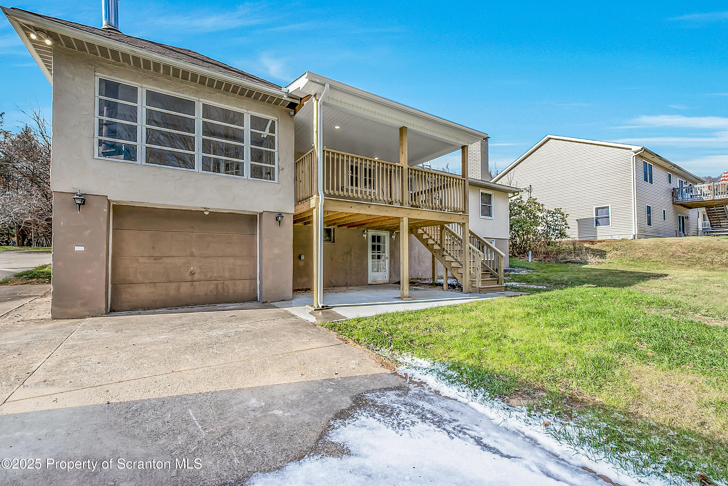 206 Gardner Street Moscow, PA 18444 - Photo 9 of 50 a front view of a house with a yard and garage