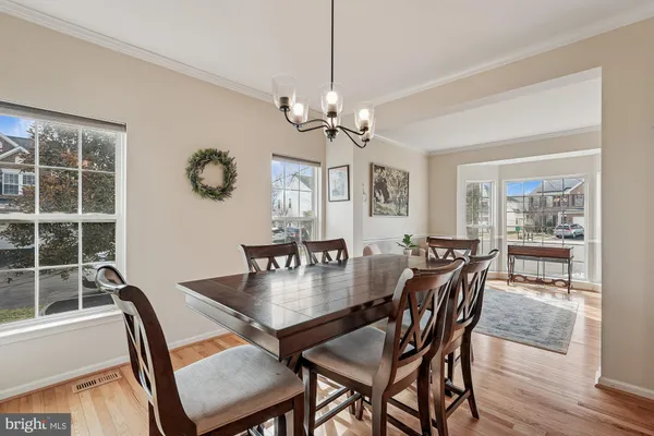 a large kitchen with stainless steel appliances kitchen island granite countertop a sink and cabinets