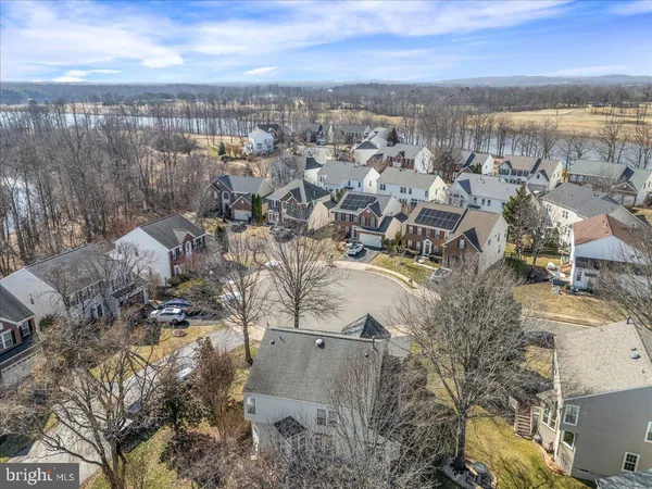a aerial view of a house with yard and sitting area
