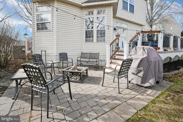 a view of a dinning table and chairs on the deck