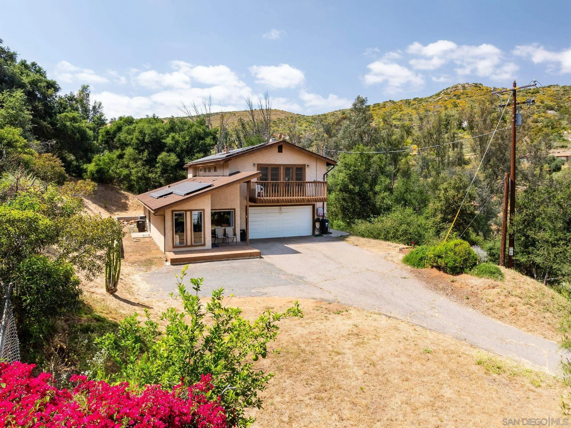 11702 Johnson Lake Road Lakeside, CA 92040 - Photo 1 of 32 a front view of a house with a yard and garden