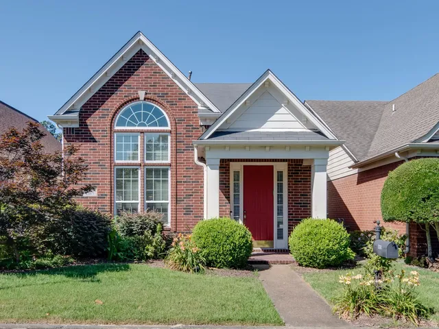 front view of a house with a yard