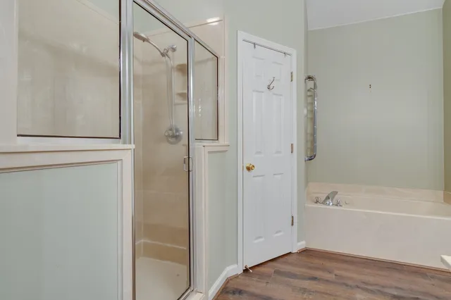 a bathroom with a bathtub and a shower
