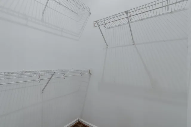 a view of a room with racks on the wall