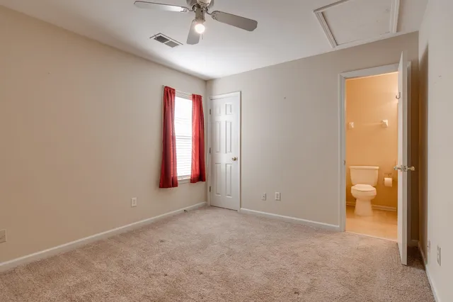 an empty room with a empty space and windows