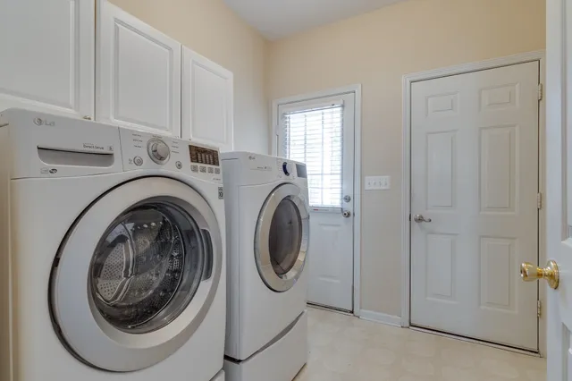a utility room with dryer and washer