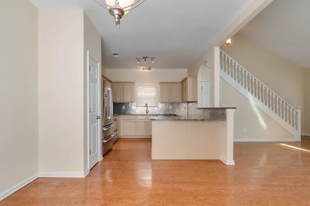 a view of kitchen and kitchen with sink