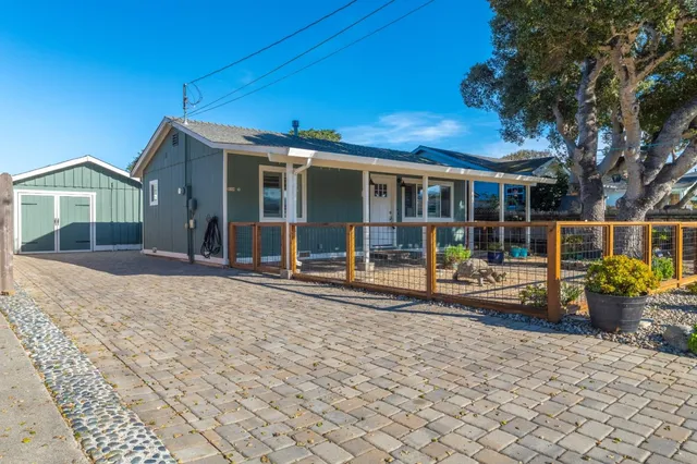 an aerial view of a house with outdoor space
