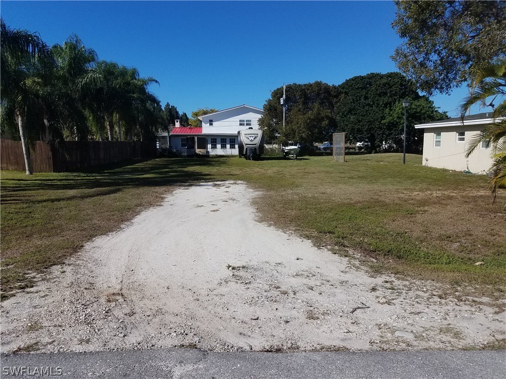 1203 Patterson Road Cape Coral, FL 33909 - Photo 3 of 3 a view of a street with a building in the background