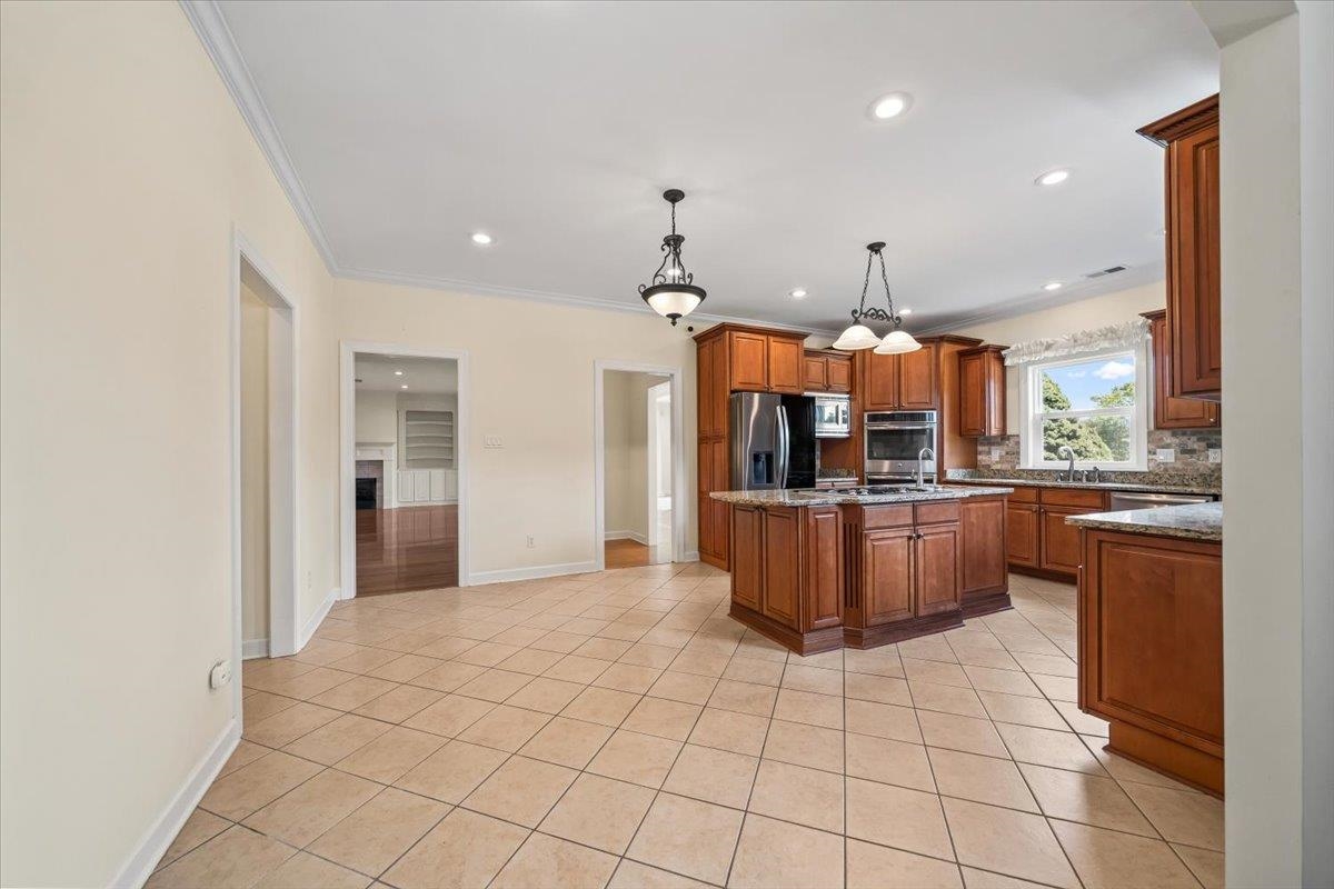 740 Frazier Road Rossville, TN 38066 - Photo 14 of 40 Spacious kitchen featuring a central island, recessed lighting, and tile flooring