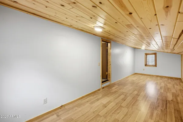 a bedroom with a bed and a table
