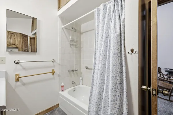 a bathroom with a sink and cabinets