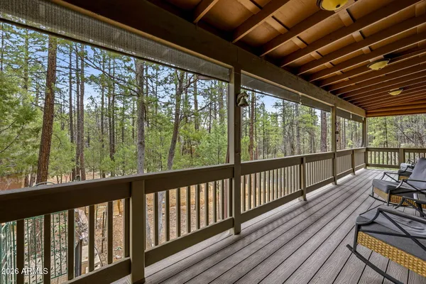 a view of balcony with wooden floor