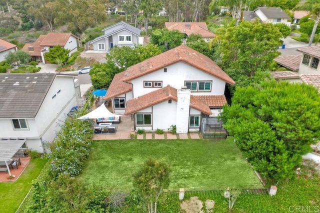 a view of a roof deck with furniture