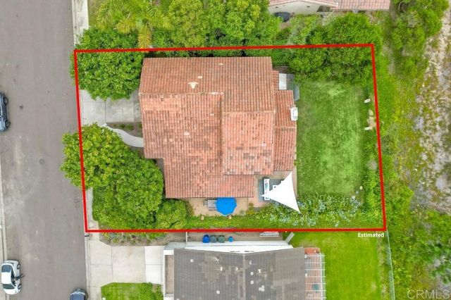 an aerial view of city and mountain