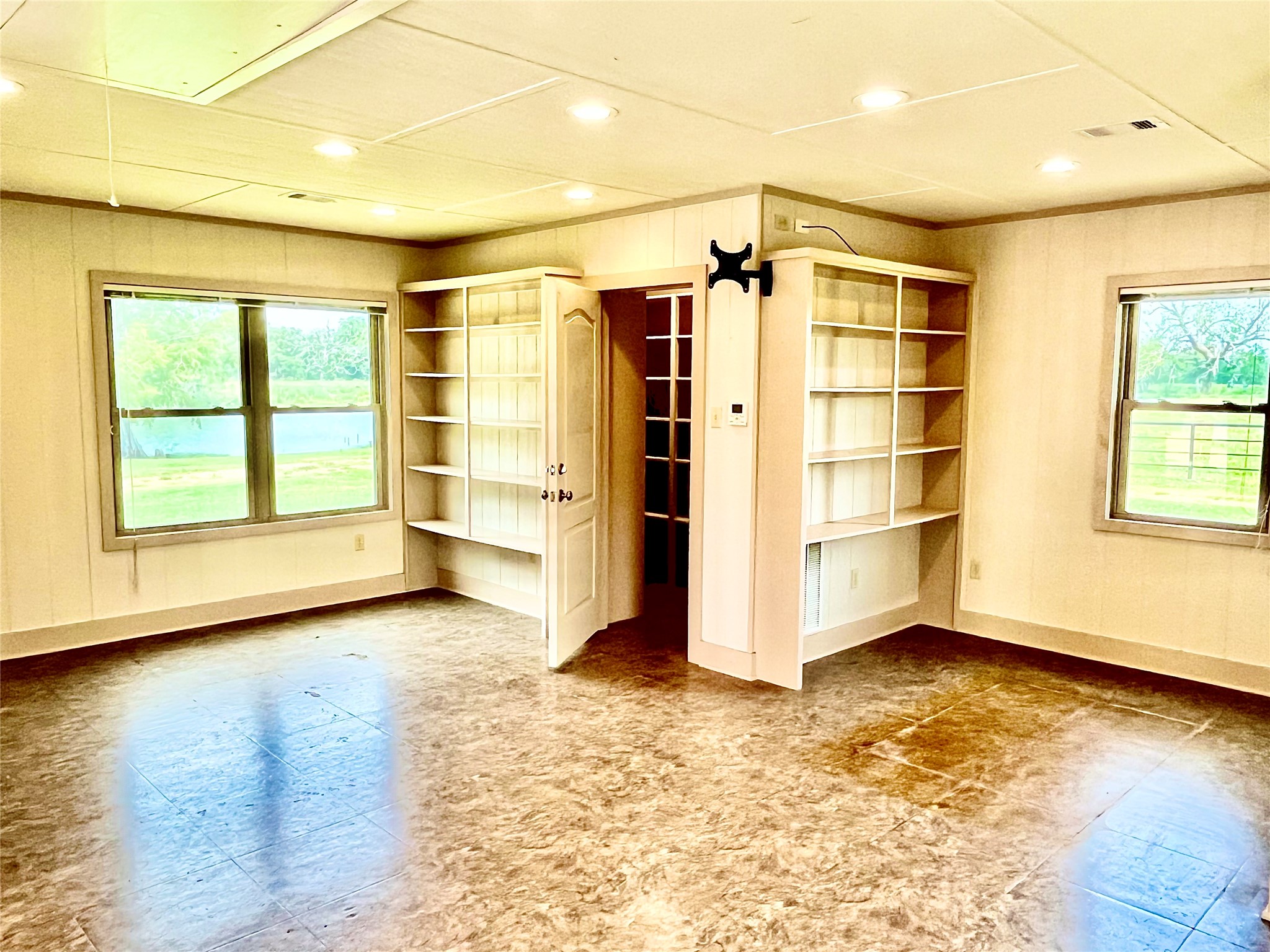 37243 FM 521 Road Bay City, TX 77414 - Photo 29 of 50 Interior of the 21' X 19' bonus, "man cave" room. More storage room here for guns and guitars or whatever makes you happy!