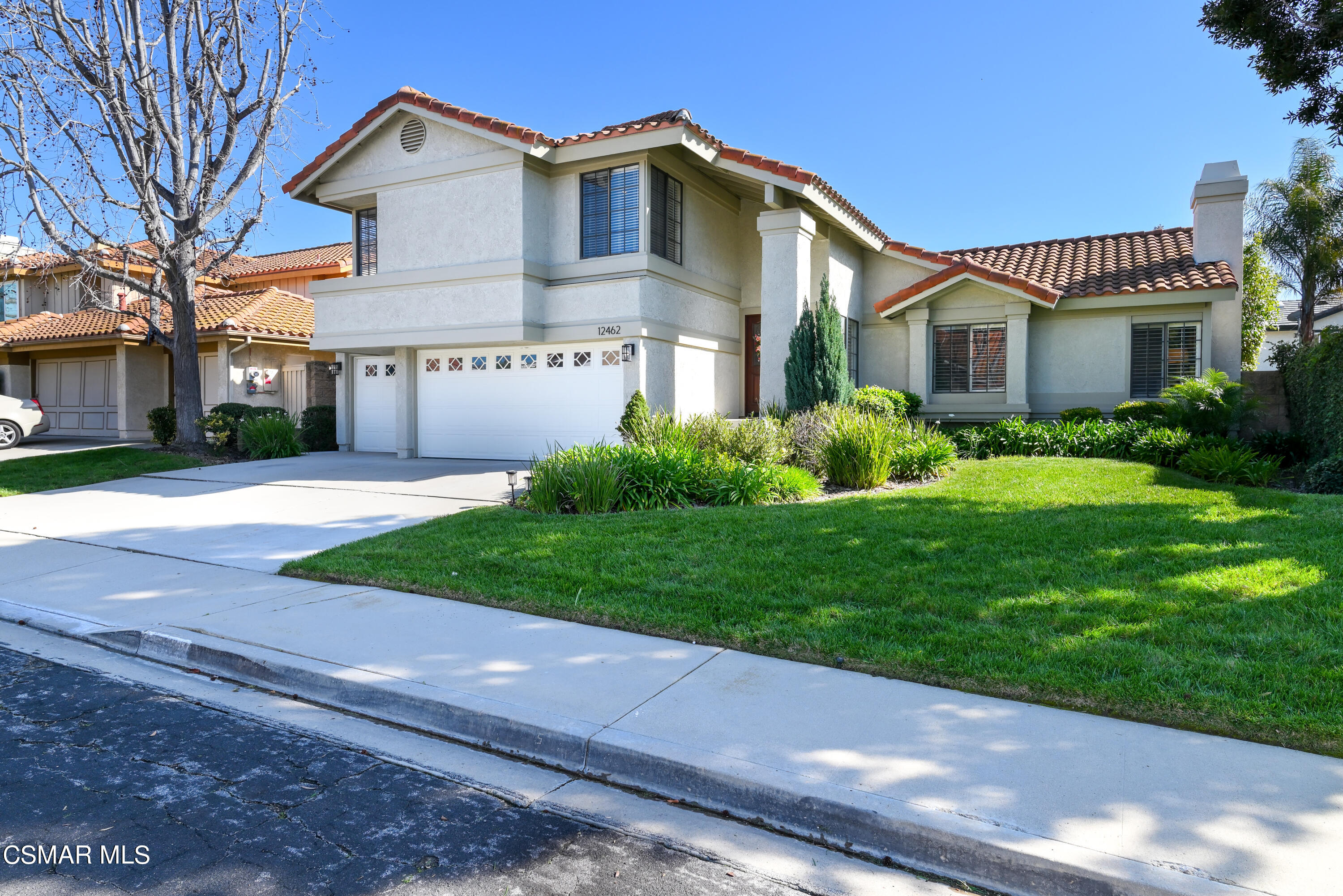 12462 Spring Creek Road Moorpark, CA 93021 - Photo 1 of 57 a front view of a house with a yard and garage