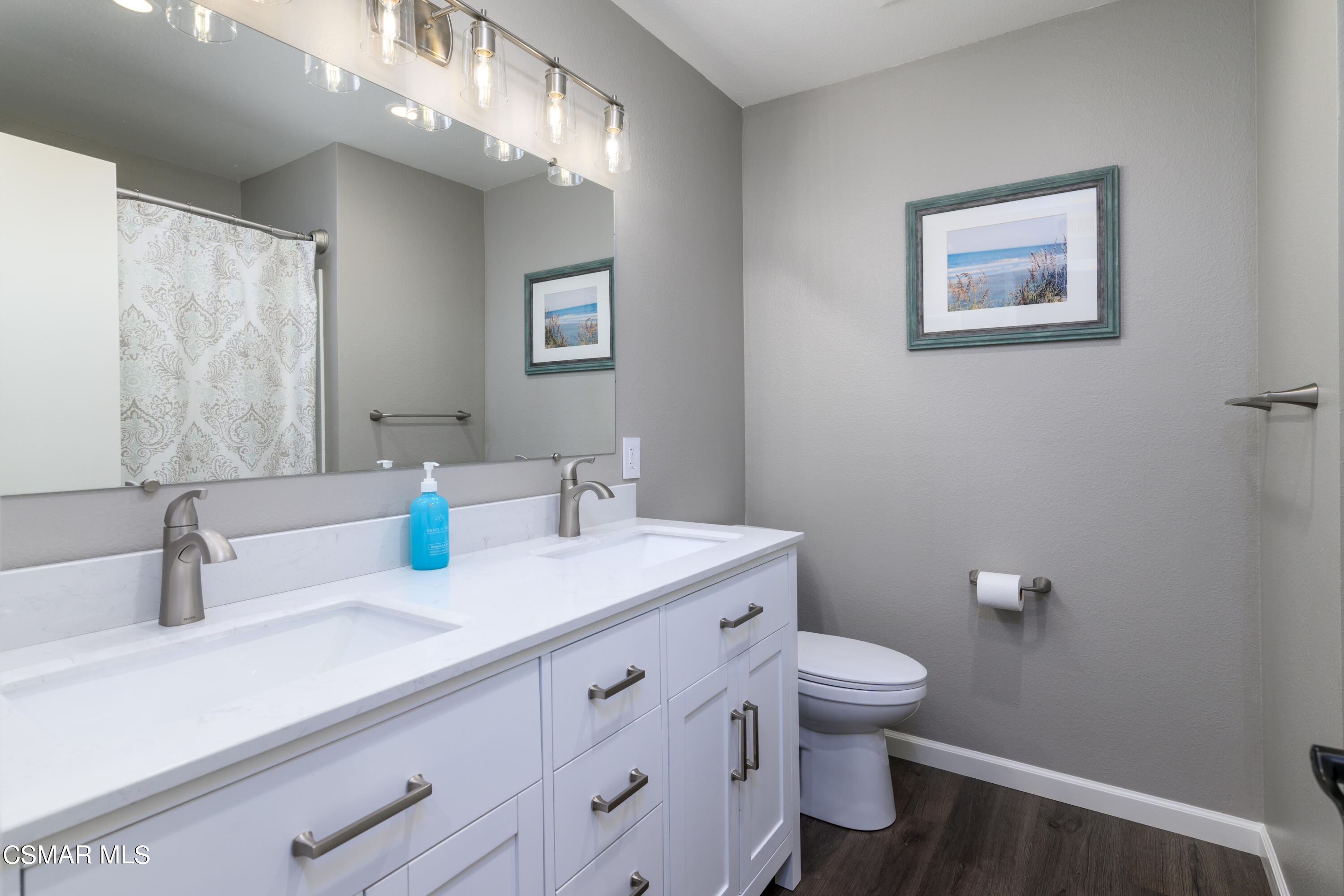 12462 Spring Creek Road Moorpark, CA 93021 - Photo 29 of 57 a bathroom with a sink a toilet and a mirror