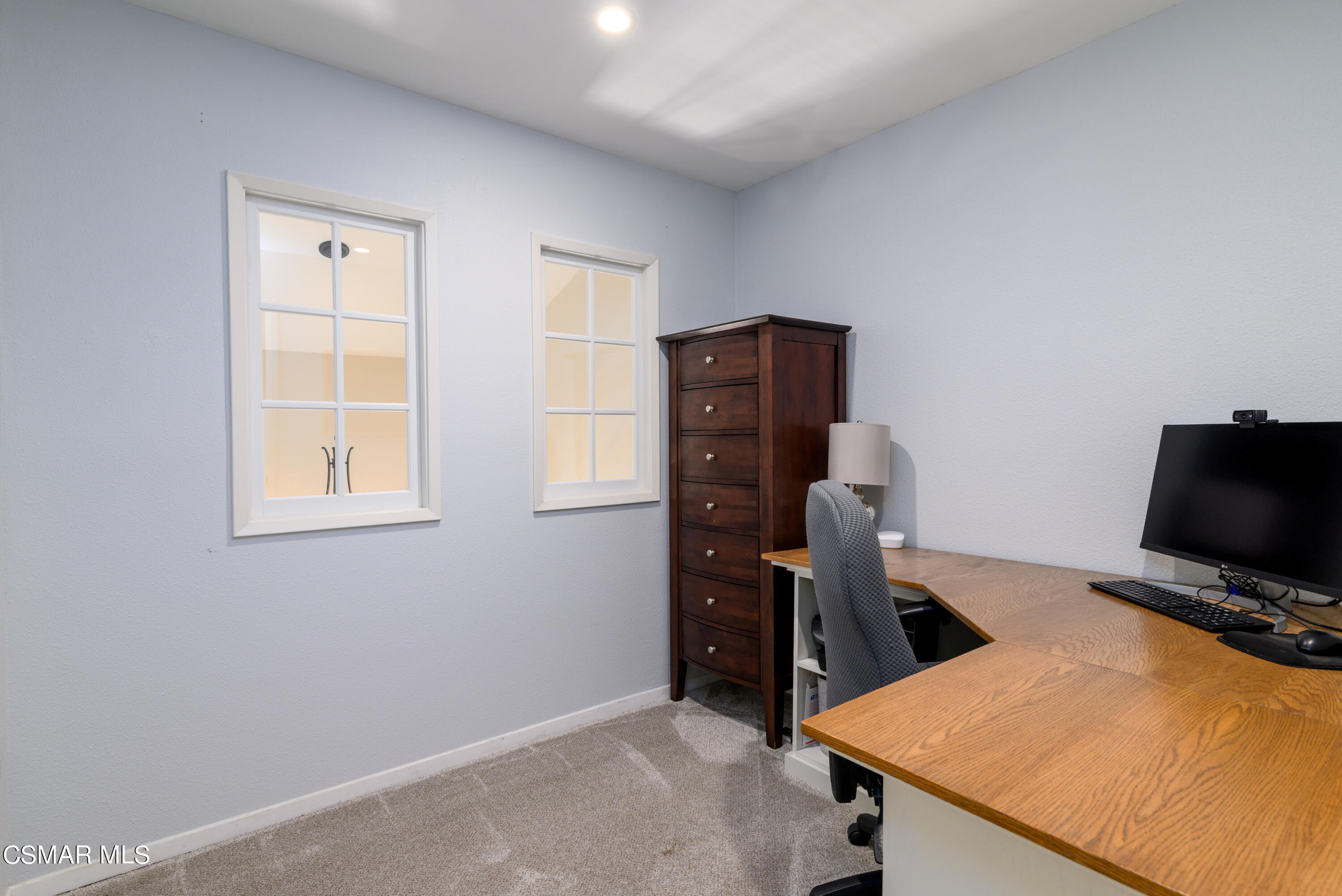 12462 Spring Creek Road Moorpark, CA 93021 - Photo 43 of 57 a view of a workspace with furniture and a window