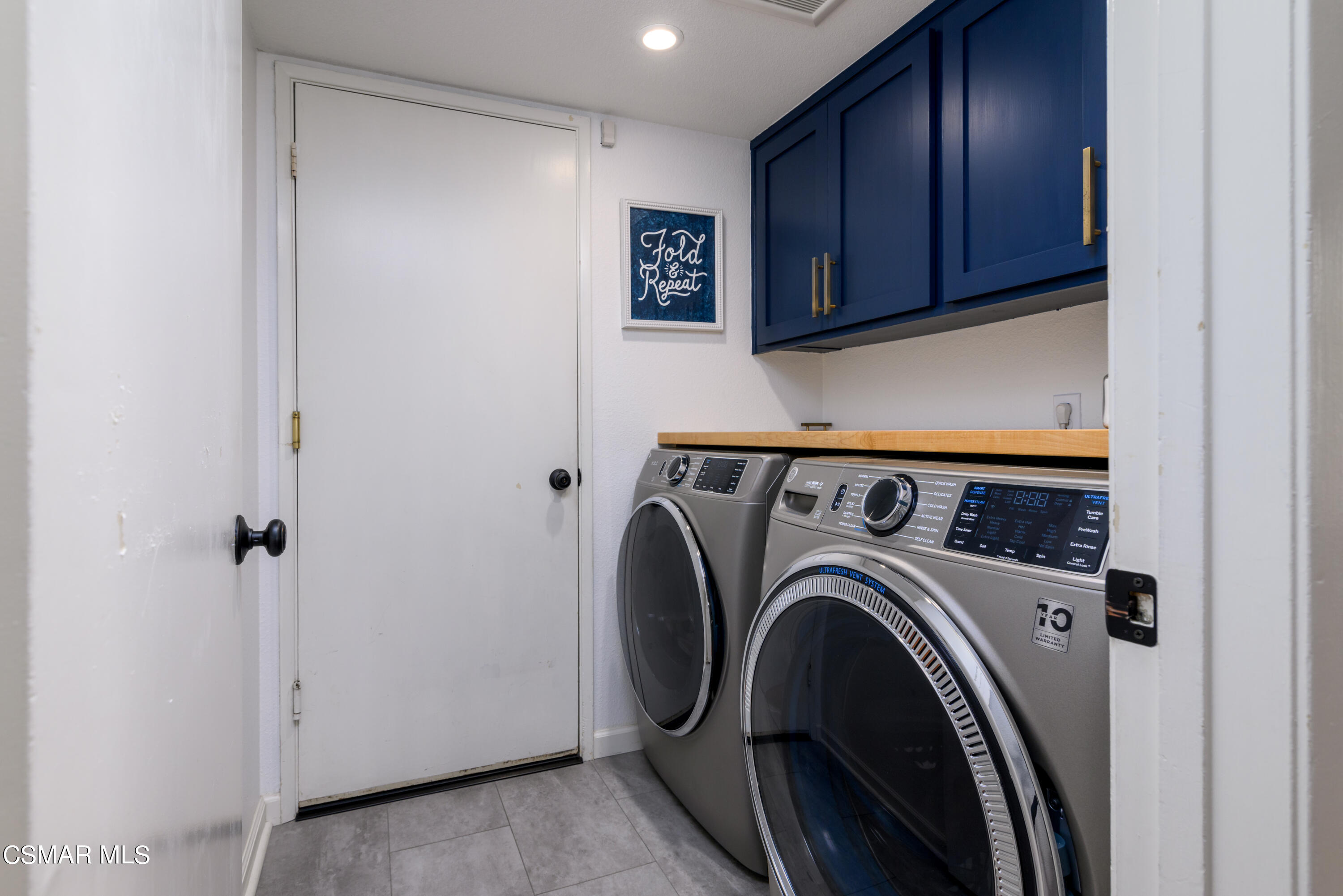 12462 Spring Creek Road Moorpark, CA 93021 - Photo 44 of 57 a view of a storage and utility room with washer and dryer
