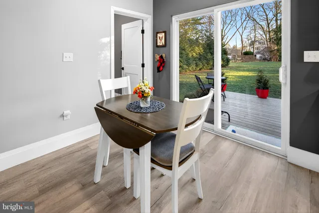 a view of kitchen with refrigerator and window
