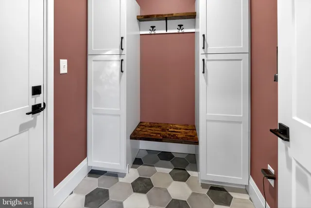 a kitchen with stainless steel appliances kitchen island granite countertop a kitchen island a stove a table and chairs