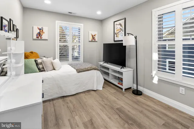 a view of a table and chairs in back yard of the house
